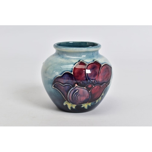 573 - A MOORCROFT POTTERY SQUAT BALUSTER VASE, mottled blue ground with pink/purple anemone design, impres... 