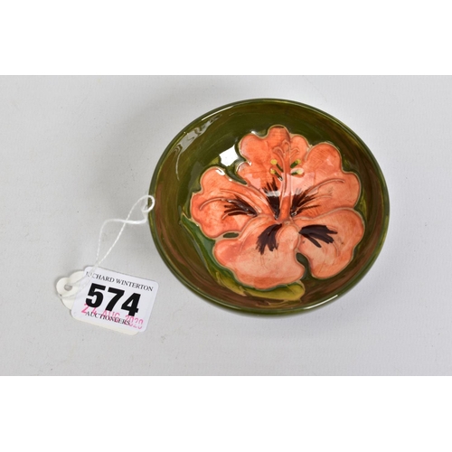 574 - A MOORCROFT POTTERY SMALL TRINKET BOWL, low circular foot, green ground with coral hibiscus, impress... 