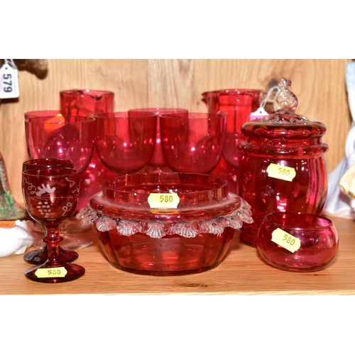 580 - THIRTEEN PIECES OF CRANBERRY GLASS, comprising two jugs, approximate height 14cm, a set of six glass... 