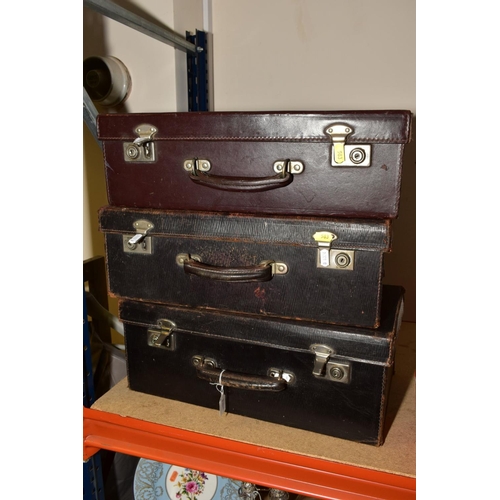 583 - THREE VINTAGE LEATHER COVERED MEDICAL CASES WITH DRAWERS FITTED TO THE INTERIORS, the lid interiors ... 