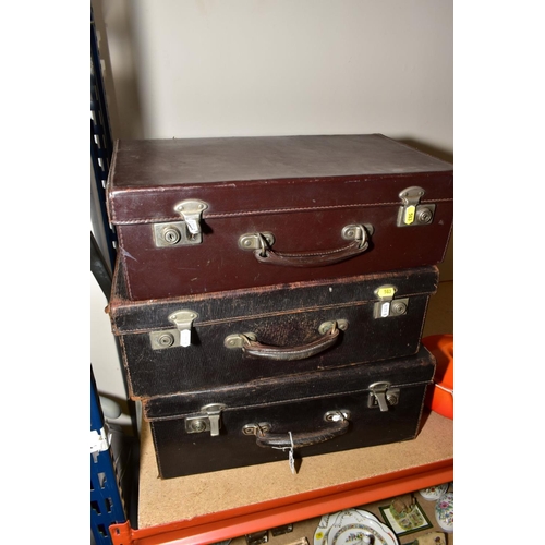 583 - THREE VINTAGE LEATHER COVERED MEDICAL CASES WITH DRAWERS FITTED TO THE INTERIORS, the lid interiors ... 