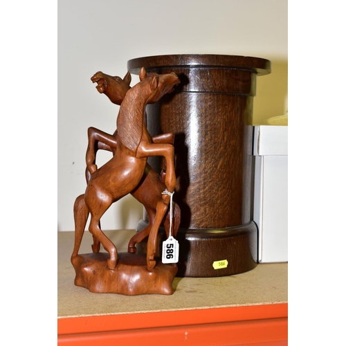 586 - A WOODEN CARVING OF TWO REARING HORSES, approximate height 31.5cm, together with a cylindrical oak v... 