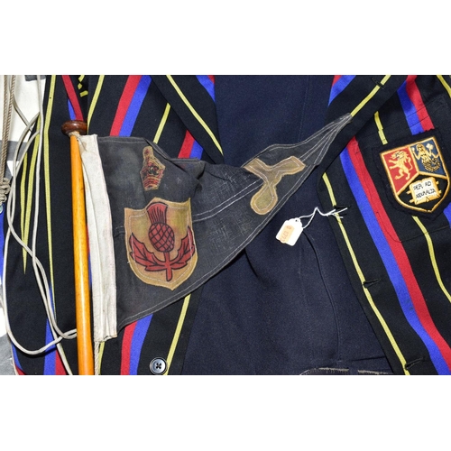 599 - A GENTS STRIPED BLAZER WITH EMBROIDERED BADGE, together with a pair of navy trousers, a sailing cap ... 