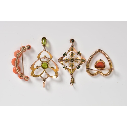 6 - FOUR EARLY 20TH CENTURY PENDANTS AND BROOCHES, to include a peridot and seed pearl set open work pen... 