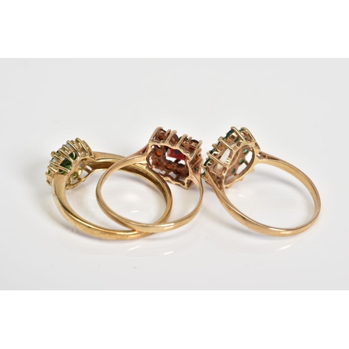 61 - THREE 9CT GOLD GEM SET CLUSTER RINGS, to include an oval cut opal with a circular cut emerald surrou... 