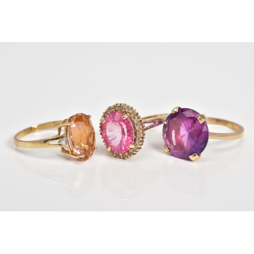 62 - THREE GEMSTONE SET RINGS, to include a circular cut sapphire within a four claw setting, with a 9ct ... 