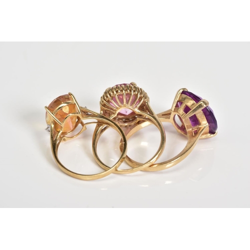 62 - THREE GEMSTONE SET RINGS, to include a circular cut sapphire within a four claw setting, with a 9ct ... 