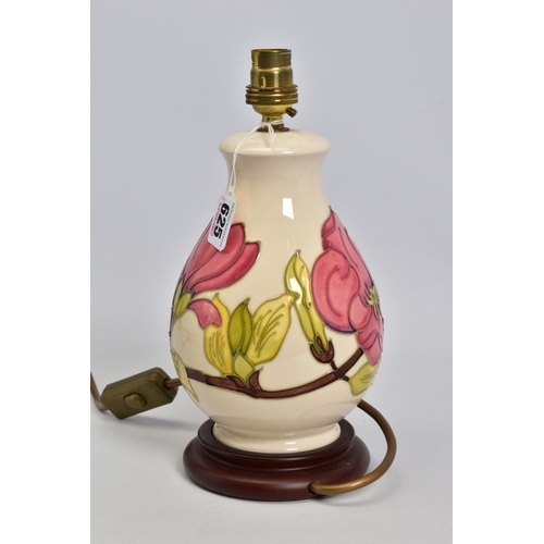 625 - A MOORCROFT POTTERY BALUSTER TABLE LAMP, cream ground with pink magnolia design, mounted on a wooden... 