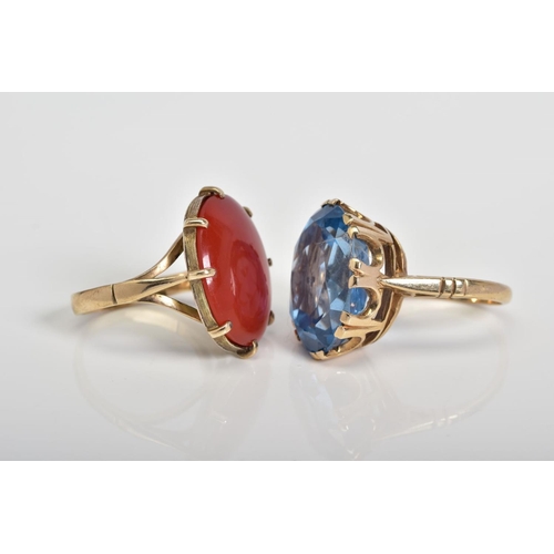 63 - TWO LARGE GEMSTONE RINGS, the first designed with a large oval cut carnelian panel within an eight c... 