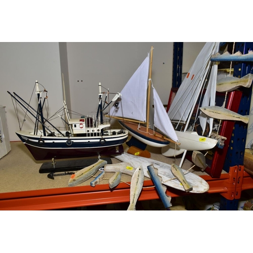 647 - A WOODEN MODEL OF A FISHING BOAT, a display case of knots, a wooden fish and waves hanging decoratio... 