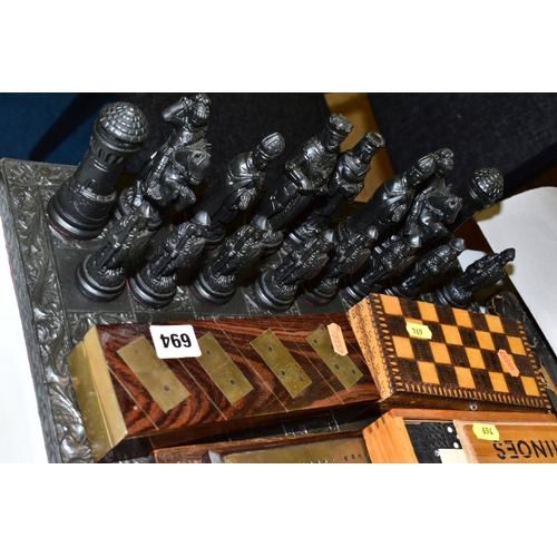 694 - A MODERN RESIN CHESS SET, with medieval style chess men, together with cribbage boards, dominoes and... 