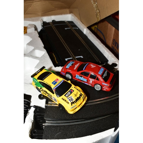 712 - A BOXED SCALEXTRIC SUPER TOURERS RACING SET, No.C1000, appears complete with both cars, track, hand ... 