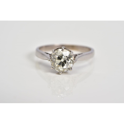 75 - A SINGLE STONE DIAMOND RING, design with an old cut diamond within an eight claw setting, to the tap... 