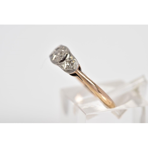 77 - AN EARLY 20TH CENTURY THREE STONE DIAMOND RING, the openwork panel set with three graduated single c... 