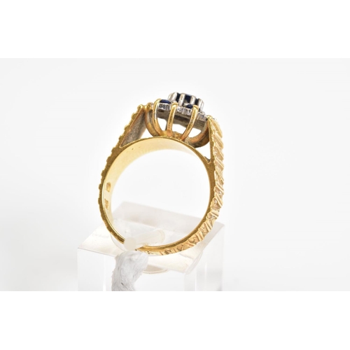 78 - AN 18CT GOLD SAPPHIRE AND DIAMOND CLUSTER RING, the tiered cluster set with a central circular cut s... 