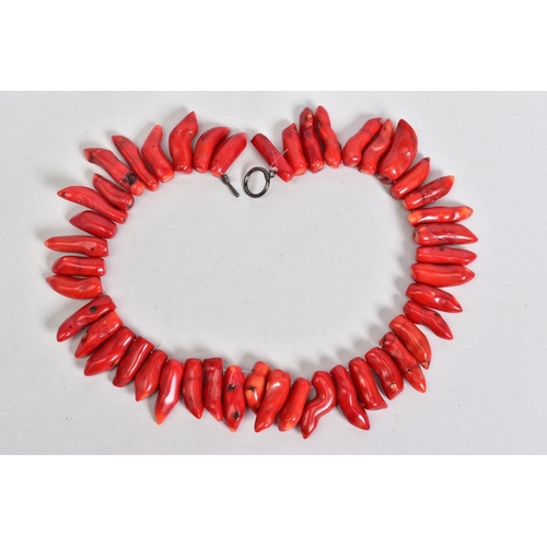 95 - A CORAL BRANCH NECKLACE, with forty five tapered dyed red coral branch beads, each measuring approxi... 