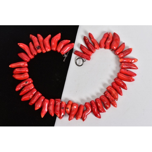 95 - A CORAL BRANCH NECKLACE, with forty five tapered dyed red coral branch beads, each measuring approxi... 