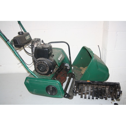 1153 - A QUALCAST CLASSIC PETROL 35S LAWN MOWER, (engine turning) with grass box and scarifier attachment (... 