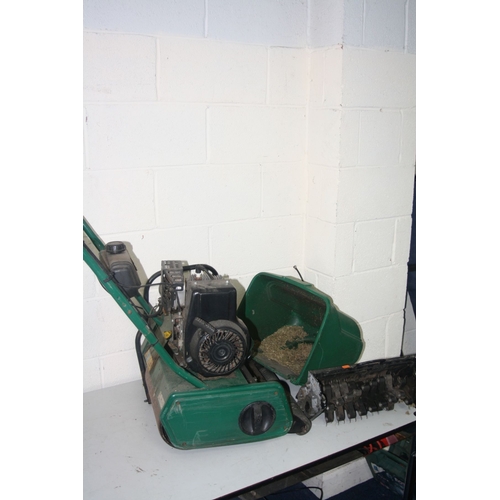 1153 - A QUALCAST CLASSIC PETROL 35S LAWN MOWER, (engine turning) with grass box and scarifier attachment (... 