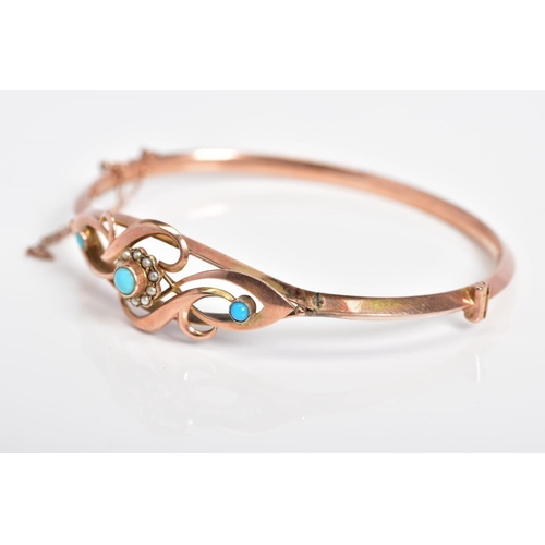 1 - A 9CT ROSE GOLD EDWARDIAN BANGLE, the hinged bangle with an openwork scroll design front, central ra... 