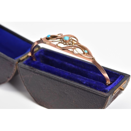 1 - A 9CT ROSE GOLD EDWARDIAN BANGLE, the hinged bangle with an openwork scroll design front, central ra... 