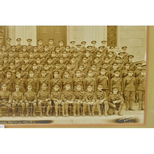 126 - A LARGE GLAZED PERIOD FRAME, approximately 64cm x 32cm, containing a mounted sepia photograph, in la... 