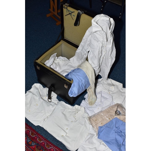 129 - A BLACK CASE FULL OF MILITARY STYLE WHITE SHIRTS AND BLOUSES FOR MEN AND WOMEN, also two beige shirt... 