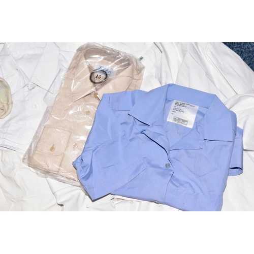 129 - A BLACK CASE FULL OF MILITARY STYLE WHITE SHIRTS AND BLOUSES FOR MEN AND WOMEN, also two beige shirt... 