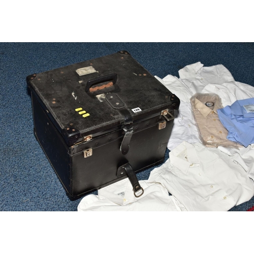 129 - A BLACK CASE FULL OF MILITARY STYLE WHITE SHIRTS AND BLOUSES FOR MEN AND WOMEN, also two beige shirt... 
