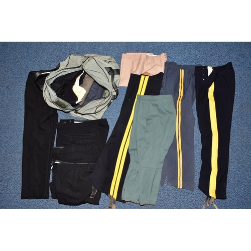 132 - A BLUE MILITARY STYLE KIT BAG, containing a number of military style Police and Civil uniform trouse... 