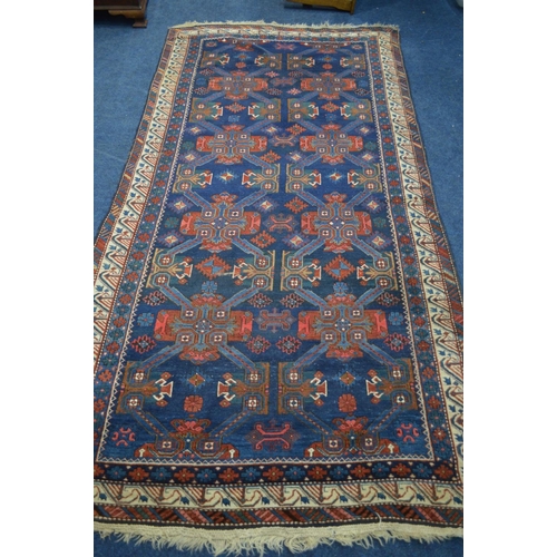 1365 - A LATE 19TH CENTURY EAGLE RAZAK BLUE GROUND RUG, the middle field with eight medallions framed by a ... 