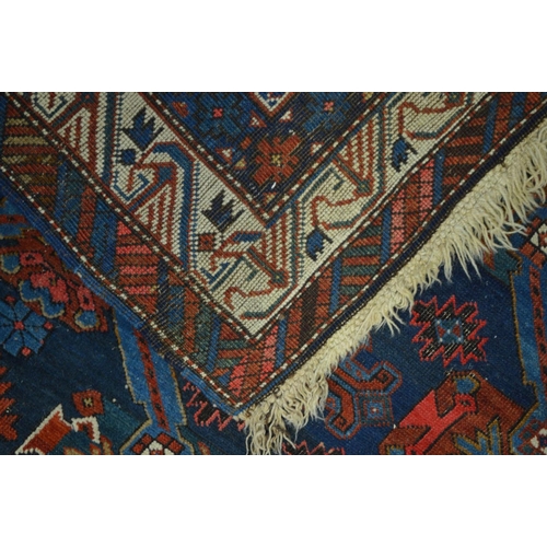 1365 - A LATE 19TH CENTURY EAGLE RAZAK BLUE GROUND RUG, the middle field with eight medallions framed by a ... 
