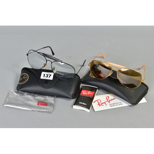 137 - TWO PAIRS OF RAY-BAN GLASSES, both of out doorsmandesign, the first with a black frame and clear len... 