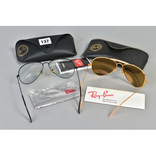 137 - TWO PAIRS OF RAY-BAN GLASSES, both of out doorsmandesign, the first with a black frame and clear len... 