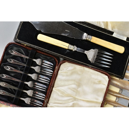 140 - A LARGE SELECTION OF FLATWARE AND CUTLERY, to include eleven white metal knives with imitation ivory... 