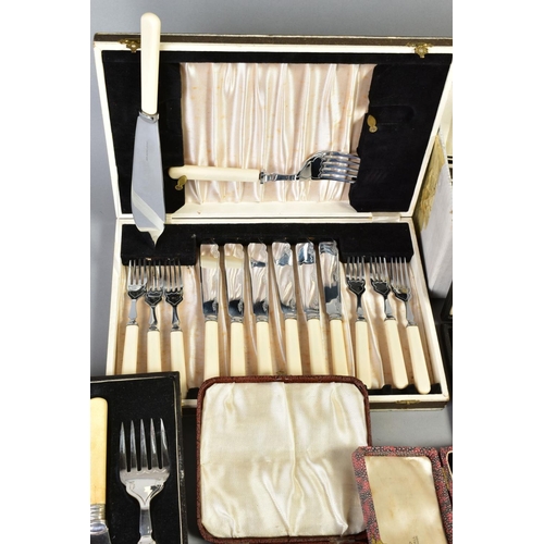 140 - A LARGE SELECTION OF FLATWARE AND CUTLERY, to include eleven white metal knives with imitation ivory... 