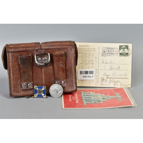 141 - A NUMBER OF WWII GERMAN ITEMS AS FOLLOWS:- two x Reichspateitag Propoganda postcards Nurnberg 1935, ... 