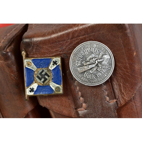 141 - A NUMBER OF WWII GERMAN ITEMS AS FOLLOWS:- two x Reichspateitag Propoganda postcards Nurnberg 1935, ... 