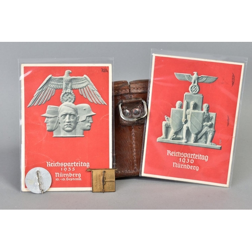 141 - A NUMBER OF WWII GERMAN ITEMS AS FOLLOWS:- two x Reichspateitag Propoganda postcards Nurnberg 1935, ... 