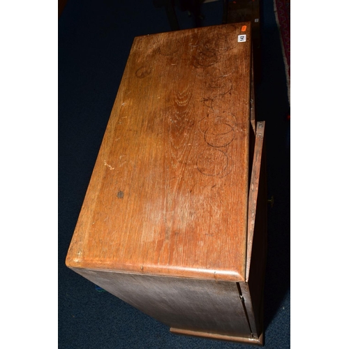 143 - A MID 20TH CENTURY LINED OAK COLLECTORS CABINET, containing trays and drawers of shells, fossils and... 