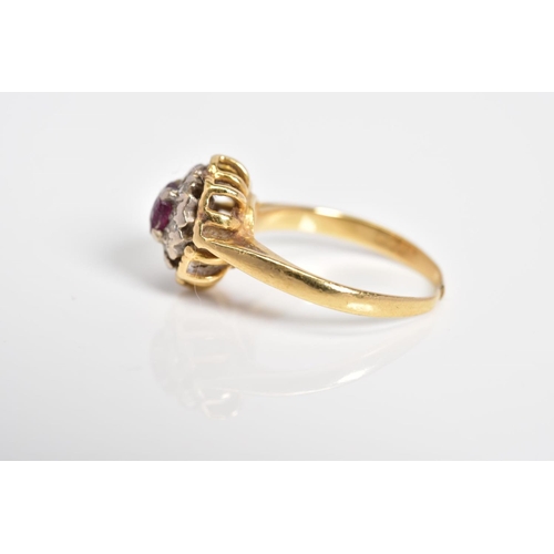 15 - A RUBY AND DIAMOND CLUSTER RING, designed with a central circular cut ruby with single cut diamond s... 