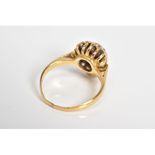 15 - A RUBY AND DIAMOND CLUSTER RING, designed with a central circular cut ruby with single cut diamond s... 