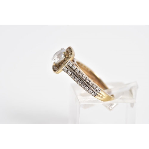 17 - A 9CT GOLD CUBIC ZIRCONIA SET RING, designed with a raised central square panel set with a circular ... 