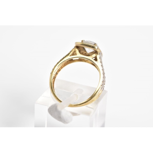 17 - A 9CT GOLD CUBIC ZIRCONIA SET RING, designed with a raised central square panel set with a circular ... 