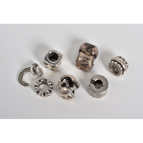 25 - A COLLECTION OF SIX PANDORA CHARMS, to include a dice, letter C initial set with colourless paste, t... 