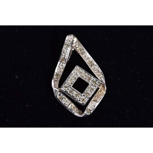 27 - A 9CT WHITE GOLD DIAMOND PENDANT, the open work drop design set with single cut diamonds, with a 9ct... 