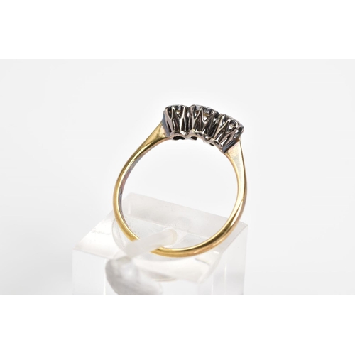 52 - AN 18CT GOLD THREE STONE DIAMOND RING, three graduated round brilliant cut diamonds illusion set, to... 