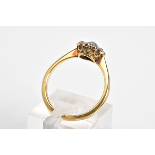 55 - A DIAMOND CLUSTER RING, the yellow metal ring set with a central old cut diamond and a single cut di... 