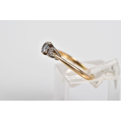 56 - A THREE STONE DIAMOND RING, the yellow metal ring set with three graduated round brilliant cut diamo... 