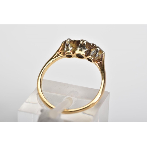 56 - A THREE STONE DIAMOND RING, the yellow metal ring set with three graduated round brilliant cut diamo... 